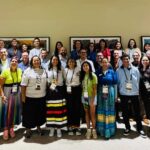 NC State Native American Alumni Network members gather in a large group for a photo.
