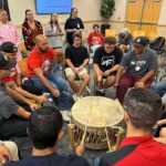 NC State Native American Alumni Network members join a drum circle.
